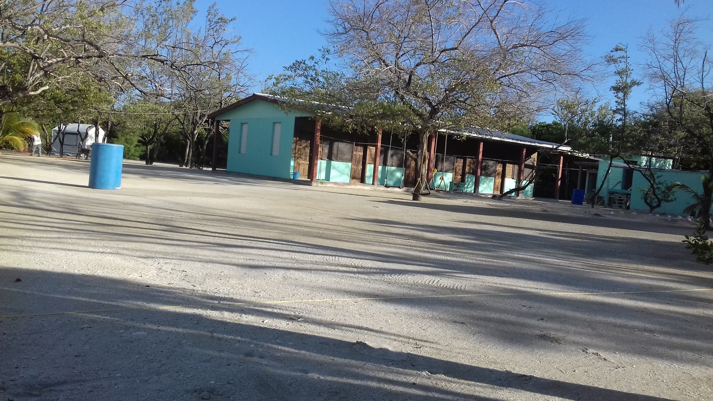 Turquoise lodge building on our private island, Belize
